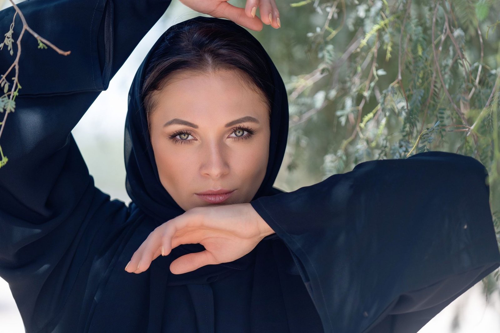 Woman in elegant black occasion wear, styled for a festive gathering