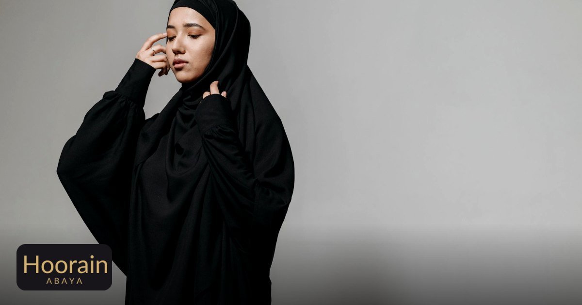 Abaya Styling Ideas for Work and Everyday Wear - a serene portrait of a young woman wearing a black hijab and abaya