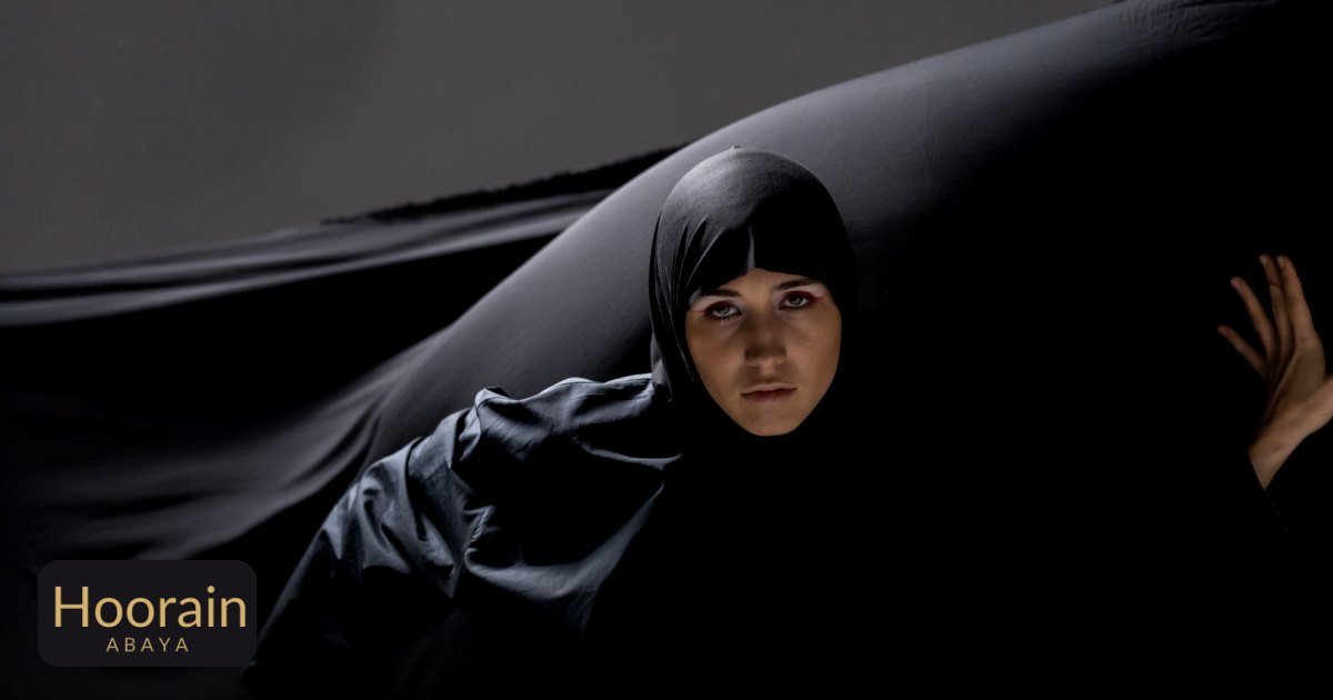 The Ultimate Bridal Abaya Guide: Styles, Fabrics & Details - studio portrait of a woman in traditional black hijab