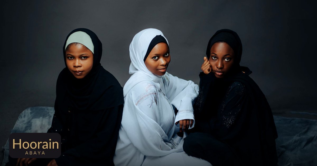 Versatile Abaya Styling Tips: From Dawn to Dusk - three women in stylish hijabs seated gracefully