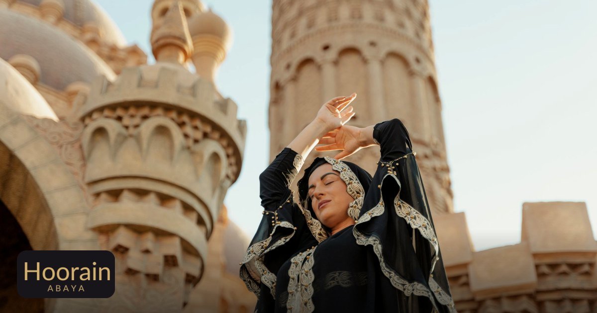 Sporty Abaya Designs UAE: The Evolution of Modest Style - a woman in traditional abaya poses gracefully outside a mosque,